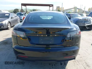 2023 Tesla Model S with VIN 5YJSA1E54PF531021, listed as a IAAI auction lot 42014104 with Not provided miles and . Bid and sale history available at DreamBid. Image 16.