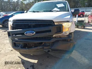 2018 Ford F-150 XL with VIN 1FTMF1CB6JKE60661, listed as a IAAI auction lot 41276885 with 142,090 mi miles. Bid and sale history available at carsss.com. Image 6.