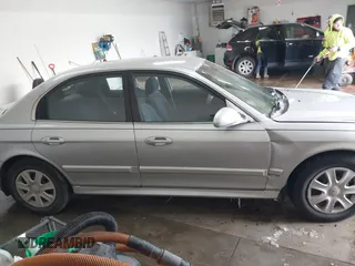 2002 Hyundai Sonata with VIN KMHWF25S42A574561, listed as a IAAI auction lot 41613838 with 141,808 mi miles. Bid and sale history available at carsss.com. Image 14.