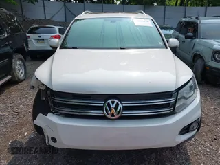 2014 Volkswagen Tiguan SEL with VIN WVGAV3AX7EW022239, listed as a IAAI auction lot 42381670 with 180,729 mi miles and . Bid and sale history available at DreamBid. Image 12.