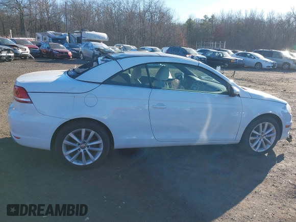 2015 Volkswagen Eos Komfort with VIN WVWBW8AH0FV001011, listed as a IAAI auction lot 41297299 with 81,444 mi miles and . Bid and sale history available at DreamBid. Image 13.