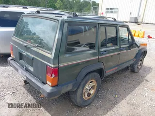 1996 Jeep Cherokee Sport with VIN 1J4FT68S6TL269966, listed as a IAAI auction lot 42211628 with 212,944 mi miles and . Bid and sale history available at DreamBid. Image 4.