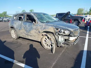 2013 Mazda CX-5 Grand Touring with VIN JM3KE2DEXD0130585, listed as a IAAI auction lot 42001388 with 66,348 mi miles. Bid and sale history available at carsss.com. Image 1.