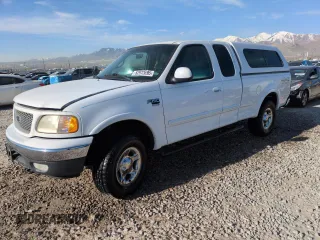 1999 Ford F-150 XL with VIN 1FTRX18L2XKA97143, listed as a Copart auction lot 52973695 with 115,180 mi miles and Salvage Title. Bid and sale history available at carsss.com. Image 1.