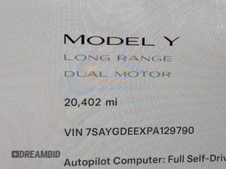 2023 Tesla Model Y Long Range with VIN 7SAYGDEEXPA129790, listed as a IAAI auction lot 41735721 with 20,402 mi miles and . Bid and sale history available at DreamBid. Image 16.