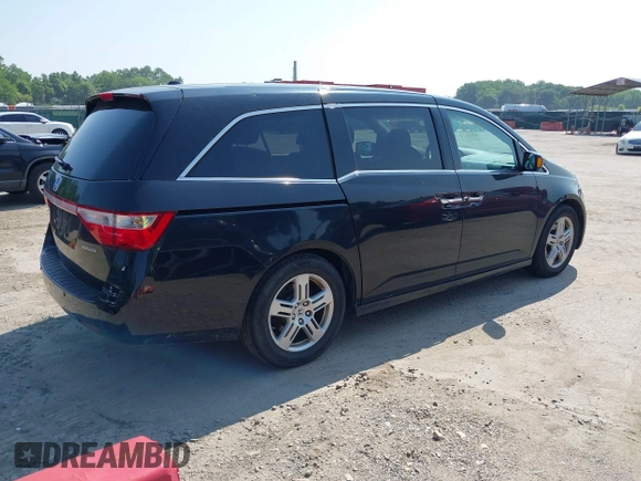2011 Honda Odyssey Touring with VIN 5FNRL5H97BB073708, listed as a IAAI auction lot 42409164 with 141,986 mi miles and . Bid and sale history available at DreamBid. Image 4.