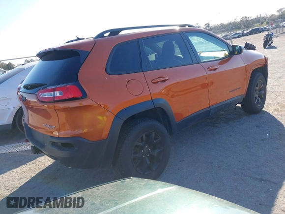 2014 Jeep Cherokee Trailhawk with VIN 1C4PJMBS4EW254879, listed as a IAAI auction lot 41550356 with 101,077 mi miles. Bid and sale history available at carsss.com. Image 4.