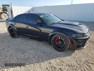 2021 Dodge Charger Scat Pack Widebody with VIN 2C3CDXGJ5MH637464, listed as a Copart auction lot 85671524 with 101,343 mi miles and Salvage Title. Bid and sale history available at carsss.com. Image 4.