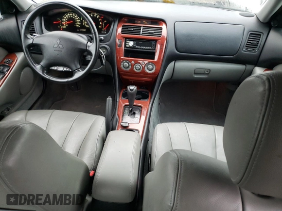2004 Mitsubishi Diamante LS z VIN 6MMAP67P34T003796, wystawiony jako Copart lot #81683284 z przebiegiem 127 882 mil mil oraz Szkody całkowita. Historia ofert i sprzedaży dostępna na DreamBid. Obrazek 8.