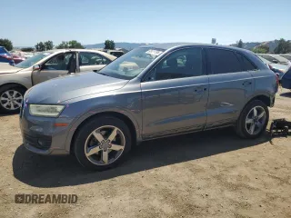 2015 Audi Q3 Premium Plus with VIN WA1EFCFSXFR012881, listed as a Copart auction lot 62411795 with 77,391 mi miles and Salvage title. Bid and sale history available at DreamBid. Image 1.