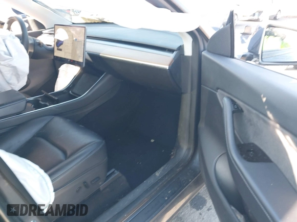 2020 Tesla Model Y Long Range with VIN 5YJYGDEE4LF030103, listed as a IAAI auction lot 41328929 with 64,896 mi miles and . Bid and sale history available at DreamBid. Image 5.