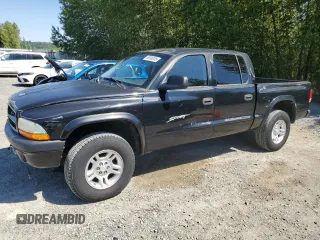 2001 Dodge Dakota Sport z VIN 1B7GG2AN81S113605, wystawiony jako Copart lot #58990065 z przebiegiem 243 919 mil mil oraz Tytuł czysty. Historia ofert i sprzedaży dostępna na DreamBid. Obrazek 1.