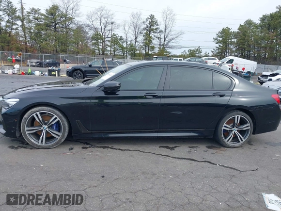 2019 BMW 7 Series 740i with VIN WBA7E2C57KB217973, listed as a IAAI auction lot 39064321 with 54,818 mi miles and . Bid and sale history available at DreamBid. Image 14.
