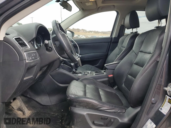 2016 Mazda CX-5 Grand Touring z VIN JM3KE4DY0G0633861, wystawiony jako Copart lot #47748645 z przebiegiem 112 219 mil mil oraz Szkoda całkowita • Salvage title. Historia ofert i sprzedaży dostępna na DreamBid. Obrazek 7.