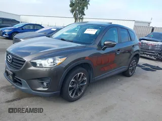 2016 Mazda CX-5 Grand Touring z VIN JM3KE4DY2G0684066, wystawiony jako IAAI lot #42078725 z przebiegiem 200 129 mil mil oraz . Historia ofert i sprzedaży dostępna na DreamBid. Obrazek 2.