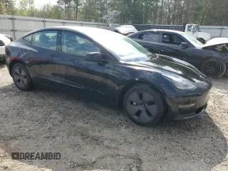 2023 Tesla Model 3 with VIN 5YJ3E1EA1PF437099, listed as a Copart auction lot 51647135 with 122,420 mi miles and Salvage Title. Bid and sale history available at carsss.com. Image 4.