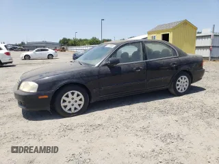 2002 Kia Optima LX z VIN KNAGD126225129497, wystawiony jako Copart lot #61109505 z przebiegiem 148 848 mil mil oraz Czysty tytuł • Clean title. Historia ofert i sprzedaży dostępna na DreamBid. Obrazek 1.