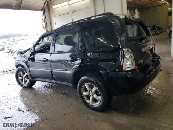 2006 Mazda Tribute LX with VIN 4F2YZ94126KM14426, listed as a Copart auction lot 85331974 with 214,950 mi miles and Salvage Title. Bid and sale history available at carsss.com. Image 2.