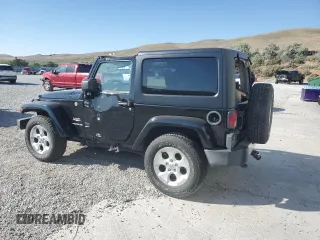 2015 Jeep Wrangler Sahara with VIN 1C4AJWBG5FL733795, listed as a Copart auction lot 61998255 with 86,655 mi miles and Salvage title. Bid and sale history available at DreamBid. Image 2.