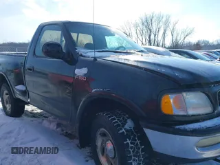 1997 Ford F-150 XL with VIN 1FTDF08W5VKD47103, listed as a IAAI auction lot 41345739 with 209,732 mi miles. Bid and sale history available at carsss.com. Image 13.