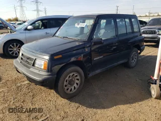 1998 Suzuki Sidekick JS z VIN 2S3TE02V1W6402490, wystawiony jako Copart lot #78316244 z przebiegiem 79 724 mil mil oraz Tytuł czysty. Historia ofert i sprzedaży dostępna na DreamBid. Obrazek 1.
