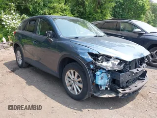 2016 Mazda CX-5 Touring z VIN JM3KE4CY8G0626562, wystawiony jako IAAI lot #42395982 z przebiegiem 57 915 mil mil oraz . Historia ofert i sprzedaży dostępna na DreamBid. Obrazek 1.