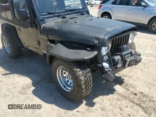 1999 Jeep Wrangler SE with VIN 1J4FY29P3XP408468, listed as a Copart auction lot 55537335 with Not provided miles and Salvage title. Bid and sale history available at DreamBid. Image 9.