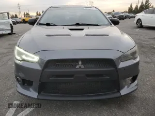 2010 Mitsubishi Lancer Evolution GSR with VIN JA32W8FV1AU027600, listed as a Copart auction lot 84328974 with 88,417 mi miles and Salvage Title. Bid and sale history available at DreamBid. Image 5.