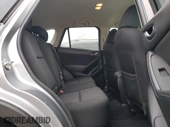 2015 Mazda CX-5 Sport with VIN JM3KE4BEXF0499688, listed as a Copart auction lot 88988095 with 258,460 mi miles and Salvage title. Bid and sale history available at DreamBid. Image 11.