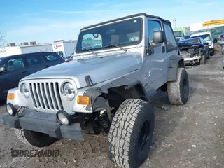 2003 Jeep Wrangler X with VIN 1J4FA39S33P363153, listed as a IAAI auction lot 41584805 with 160,676 mi miles. Bid and sale history available at carsss.com. Image 6.