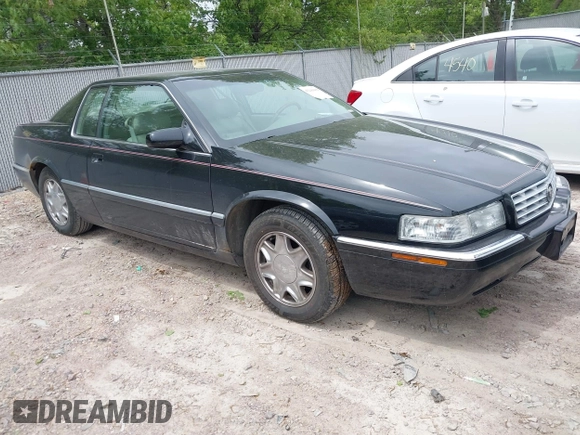 2002 Cadillac Eldorado ESC z VIN 1G6EL12Y82B105241, wystawiony jako IAAI lot #42241609 z przebiegiem 90 442 mil mil oraz . Historia ofert i sprzedaży dostępna na DreamBid. Obrazek 1.