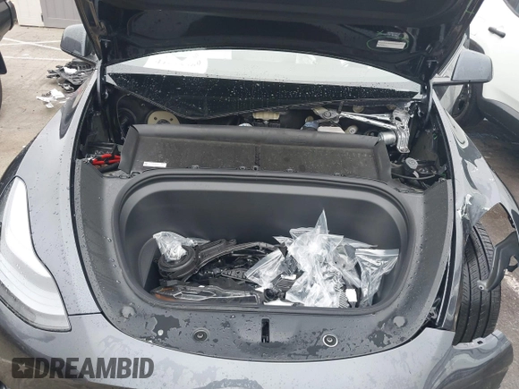 2025 Tesla Model Y Long Range with VIN 7SAYGDED8SA340082, listed as a IAAI auction lot 41915369 with 7,296 mi miles and . Bid and sale history available at DreamBid. Image 10.