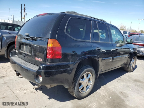 2005 GMC Envoy SLE with VIN 1GKDT13S752390266, listed as a Copart auction lot 50766935 with 115,225 mi miles and Salvage Title. Bid and sale history available at carsss.com. Image 3.