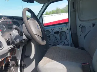 2014 Ford Econoline Cargo Commercial with VIN 1FTNS2EW2EDA83939, listed as a IAAI auction lot 42159453 with 148,947 mi miles. Bid and sale history available at carsss.com. Image 5.