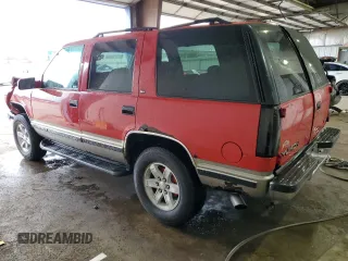 1999 GMC Yukon with VIN 1GKEK13R1XJ711537, listed as a Copart auction lot 51658175 with 228,786 mi miles and Salvage Title. Bid and sale history available at carsss.com. Image 2.