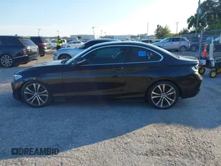 2015 BMW 2 Series 228i with VIN WBA1F5C58FV257021, listed as a IAAI auction lot 41318026 with 154,906 mi miles. Bid and sale history available at carsss.com. Image 14.
