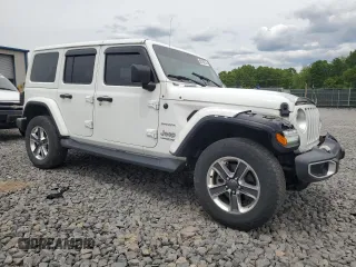 2020 Jeep Wrangler Unlimited Sahara with VIN 1C4HJXENXLW224455, listed as a Copart auction lot 58184255 with 42,885 mi miles and Salvage title. Bid and sale history available at DreamBid. Image 4.