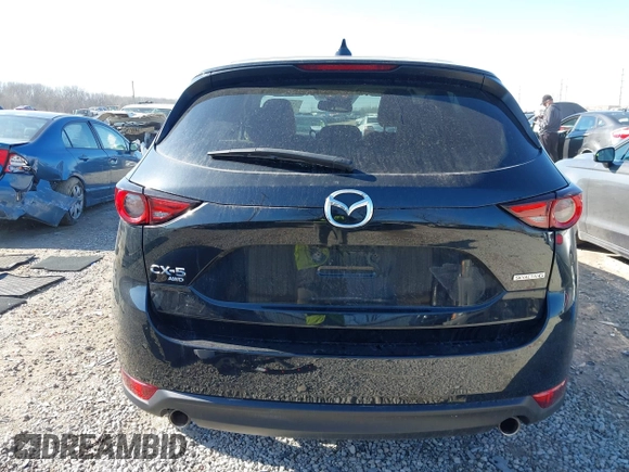2021 Mazda CX-5 Grand Touring with VIN JM3KFBDM0M0468081, listed as a IAAI auction lot 41894411 with 54,664 mi miles. Bid and sale history available at carsss.com. Image 17.
