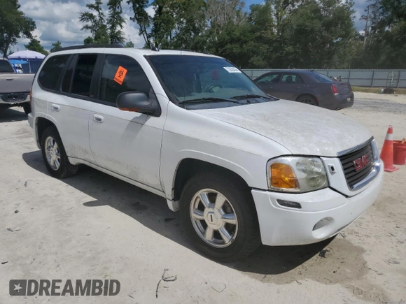 2005 GMC Envoy SLT with VIN 1GKDT13S052311455, listed as a Copart auction lot 73635434 with Not Provided miles and Salvage Title. Bid and sale history available at DreamBid. Image 4.
