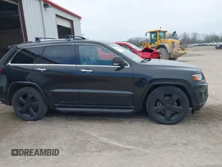 2014 Jeep Grand Cherokee Overland with VIN 1C4RJFCM8EC486259, listed as a IAAI auction lot 42105296 with 129,342 mi miles. Bid and sale history available at carsss.com. Image 13.