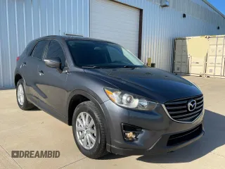 2016 Mazda CX-5 Touring z VIN JM3KE2CY4G0897686, wystawiony jako Copart lot #58271035 z przebiegiem 181 044 mil mil oraz Czysty tytuł • Clean title. Historia ofert i sprzedaży dostępna na DreamBid. Obrazek 1.