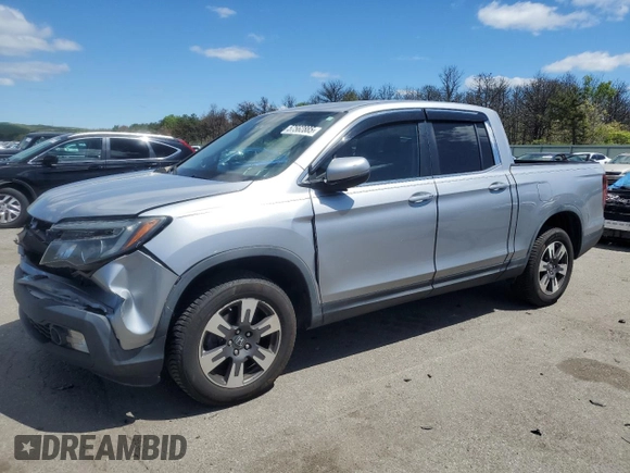 2017 Honda Ridgeline RTL-T with VIN 5FPYK3F65HB012868, listed as a Copart auction lot 57562885 with 115,530 mi miles and Salvage title. Bid and sale history available at DreamBid. Image 1.