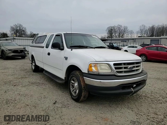 2001 Ford F-150 XL with VIN 1FTRX17L51NB25752, listed as a Copart auction lot 48721235 with 179,941 mi miles and Salvage title. Bid and sale history available at DreamBid. Image 11.