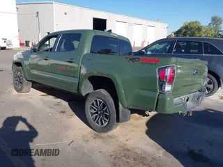 2021 Toyota Tacoma SR with VIN 3TYCZ5AN2MT039450, listed as a IAAI auction lot 40457613 with 54,176 mi miles and . Bid and sale history available at DreamBid. Image 3.