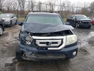 2009 Honda Pilot EX-L with VIN 5FNYF48699B055062, listed as a IAAI auction lot 41967409 with 300,781 mi miles and . Bid and sale history available at carsss.com. Image 12.