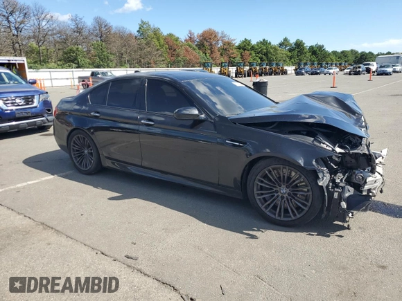 2014 BMW M5 z VIN WBSFV9C53ED594132, wystawiony jako Copart lot #67114384 z przebiegiem 89 020 mil mil oraz Szkoda całkowita • Salvage title. Historia ofert i sprzedaży dostępna na DreamBid. Obrazek 4.