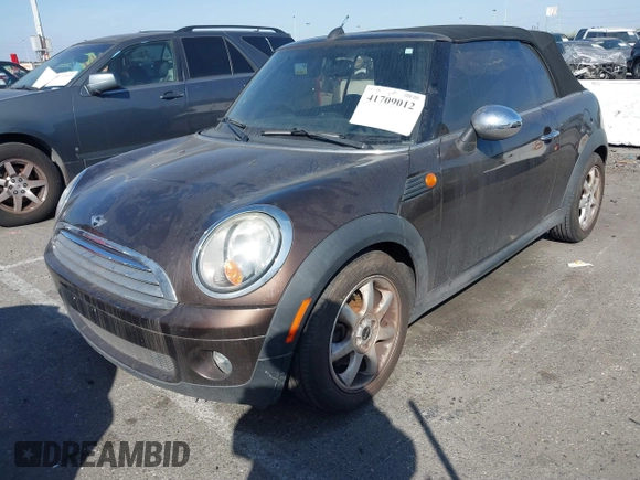 2010 MINI Convertible with VIN WMWMR3C50ATU97550, listed as a IAAI auction lot 41709012 with 86,499 mi miles and . Bid and sale history available at DreamBid. Image 2.