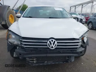 2014 Volkswagen Passat S with VIN 1VWAS7A34EC120855, listed as a IAAI auction lot 42134586 with 61,825 mi miles and . Bid and sale history available at DreamBid. Image 6.