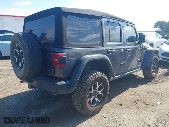 2021 Jeep Wrangler Unlimited Rubicon with VIN 1C4HJXFN5MW509483, listed as a IAAI auction lot 42245703 with 59,461 mi miles and . Bid and sale history available at DreamBid. Image 4.