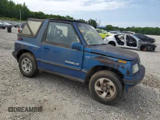 1993 Geo Tracker z VIN 2CNBJ18UXP6921660, wystawiony jako Copart lot #58027275 z przebiegiem 64 349 mil mil oraz Tytuł czysty. Historia ofert i sprzedaży dostępna na DreamBid. Obrazek 4.